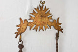 Historical cooking tools with sunburst design