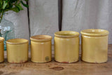 Collection of 7 antique French yellow ware pots
