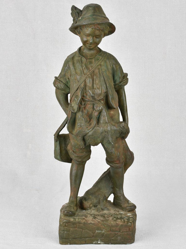 Antique cast iron statue of a boy after the hunt 21¼"