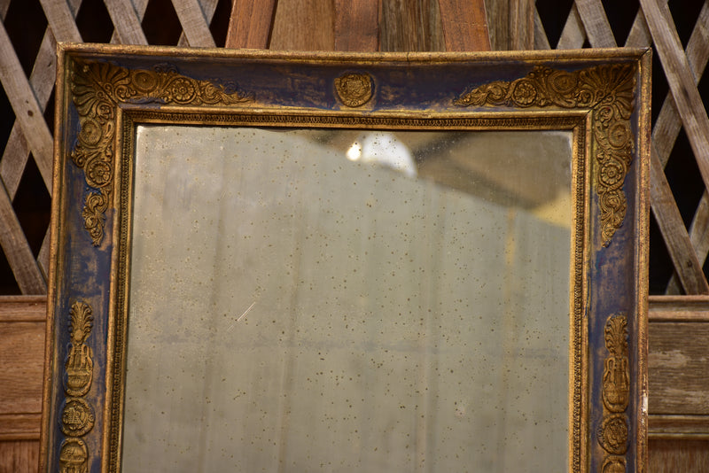 Early 19th century French restoration mirror with blue patina