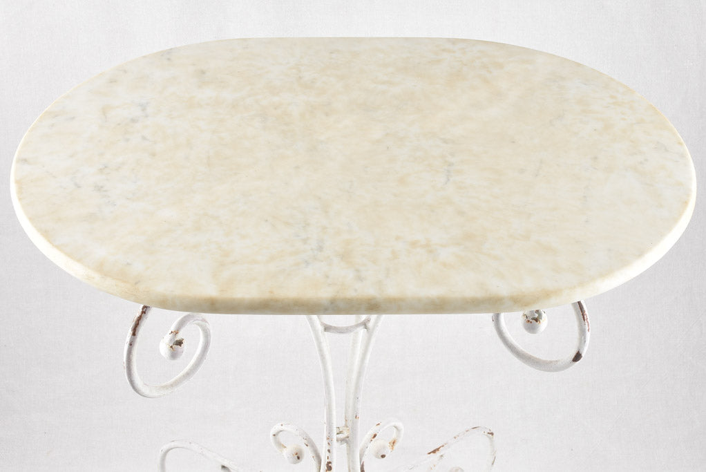 Oval marble garden table with wrought iron base 19¼" x 27½"