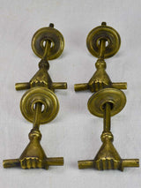Four 19th Century english door handles in the shape of hands