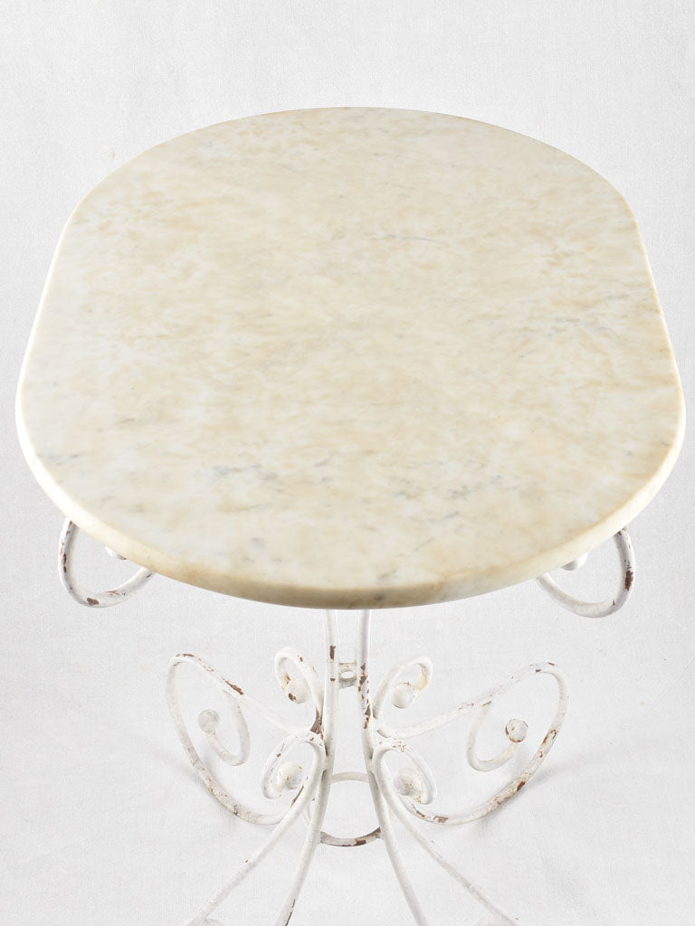 Oval marble garden table with wrought iron base 19¼" x 27½"