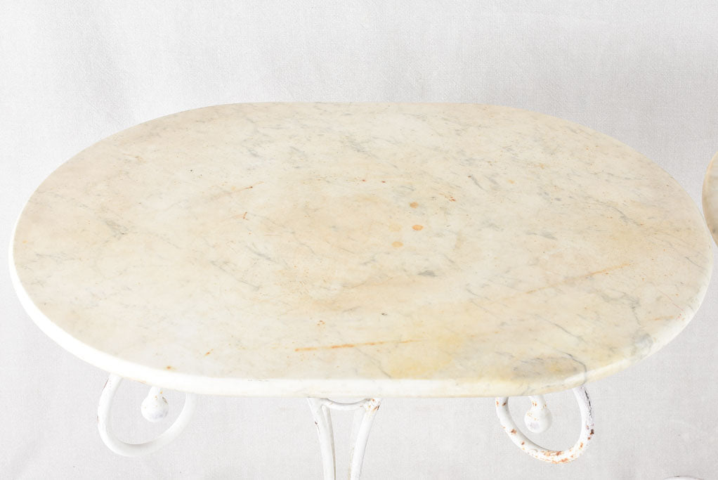 Oval marble garden table with wrought iron base 19¼" x 27½"