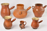 Antique brown glazed pots with feet