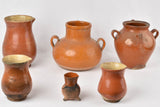 Rustic brown pots with cooking wear