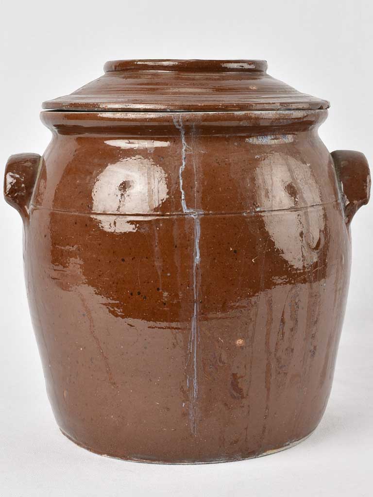 Well-loved brown crock lid pot