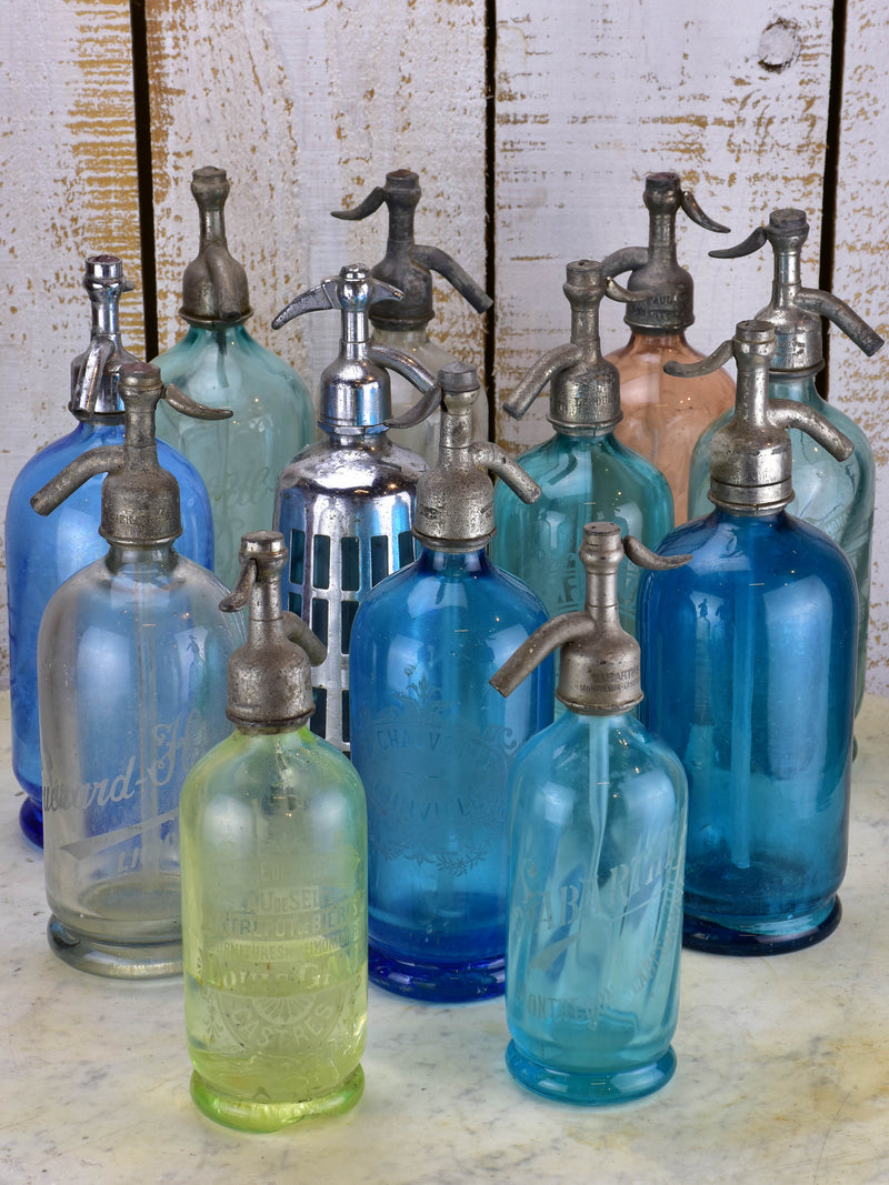 Collection of 12 antique French seltzer bottles