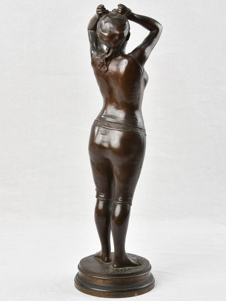 Aged bronze figurative lady statue