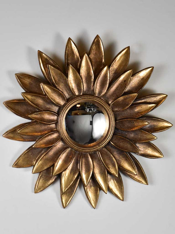 Vintage sunburst mirror with petal frame and convex glass 13"