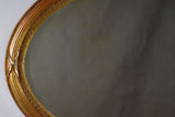 Early twentieth-century oval French mirror with bronzed glass 34¼" x 21¾"