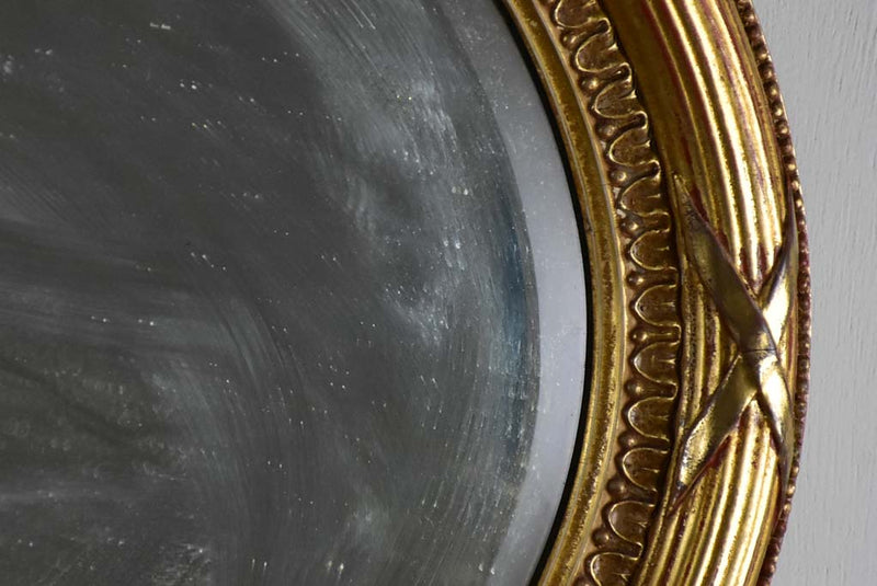Early twentieth-century oval French mirror with bronzed glass 34¼" x 21¾"