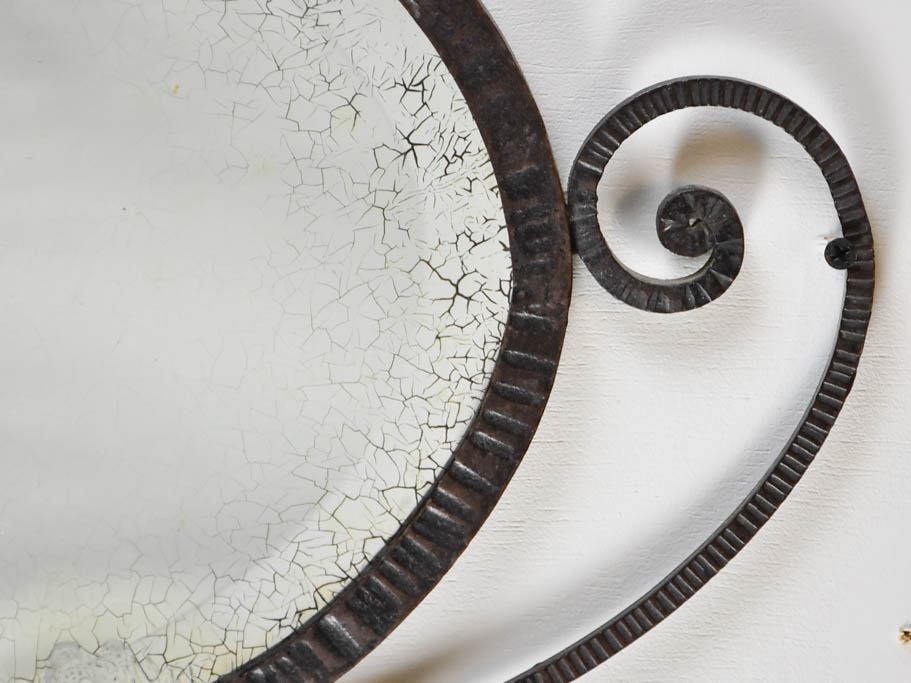Small Art Deco oval mirror with wrought iron frame 12½" x 22¾"