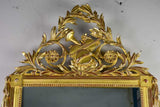 Louis XVI-style gilded mirror with musical floral crest and motifs 26½" x 46¾"