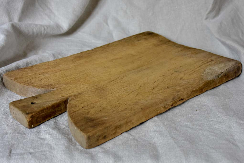 Antique French cutting board with curved peaked shoulders 16½"