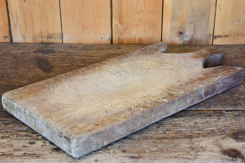 Large antique French cutting board with curved shoulders
