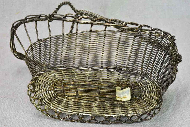 Traditional woven metal wine carrier