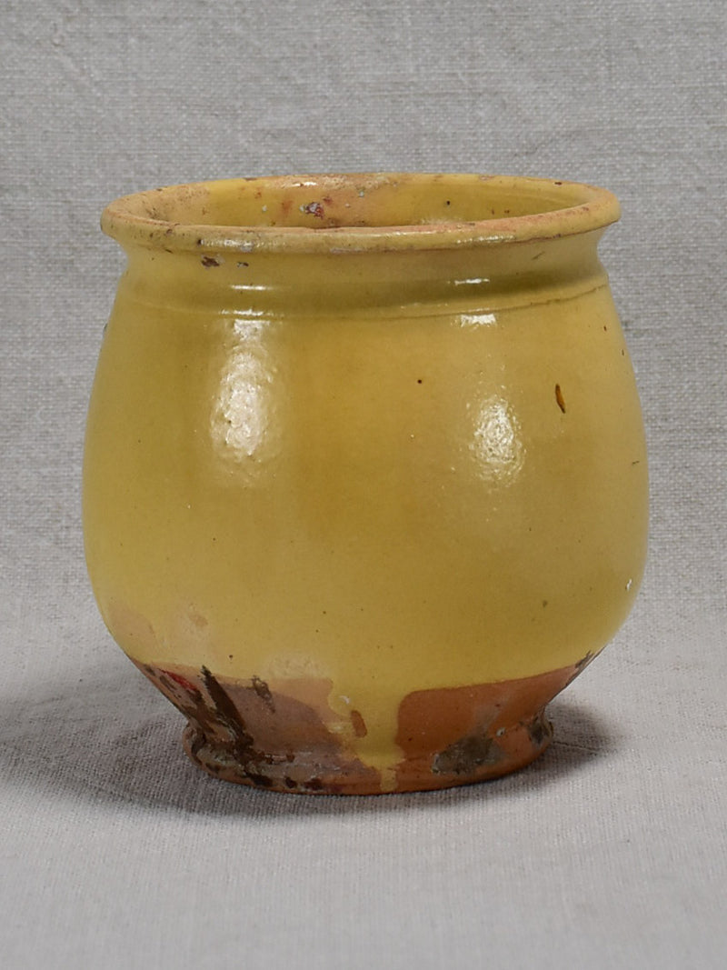 Antique French confit pot with no handles and yellow glaze 5"