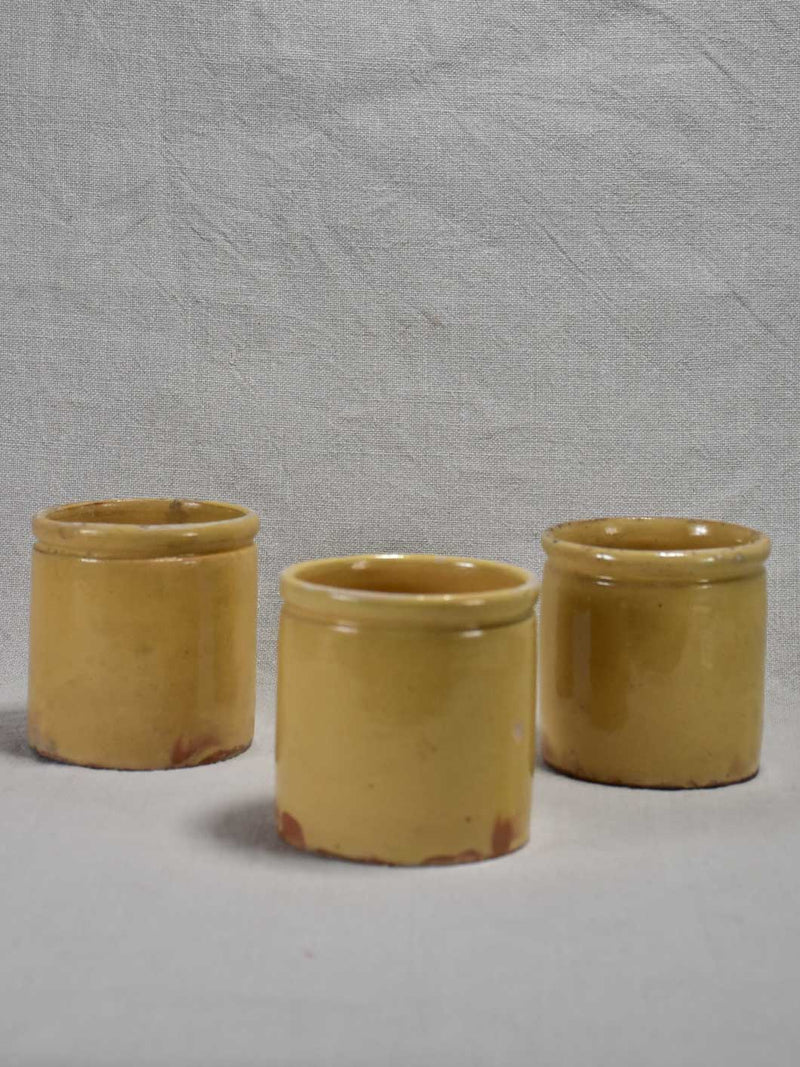 Three antique French yellow ware preserving jars 3½"