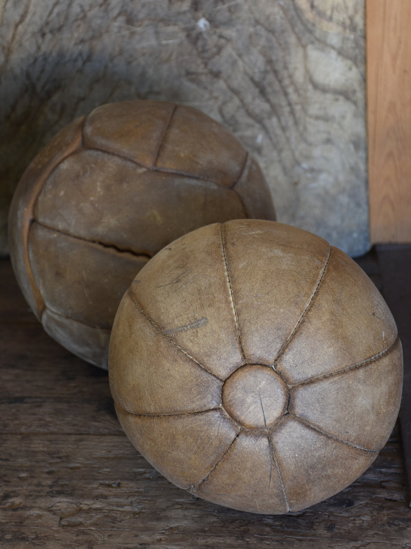Two antique French medicine balls