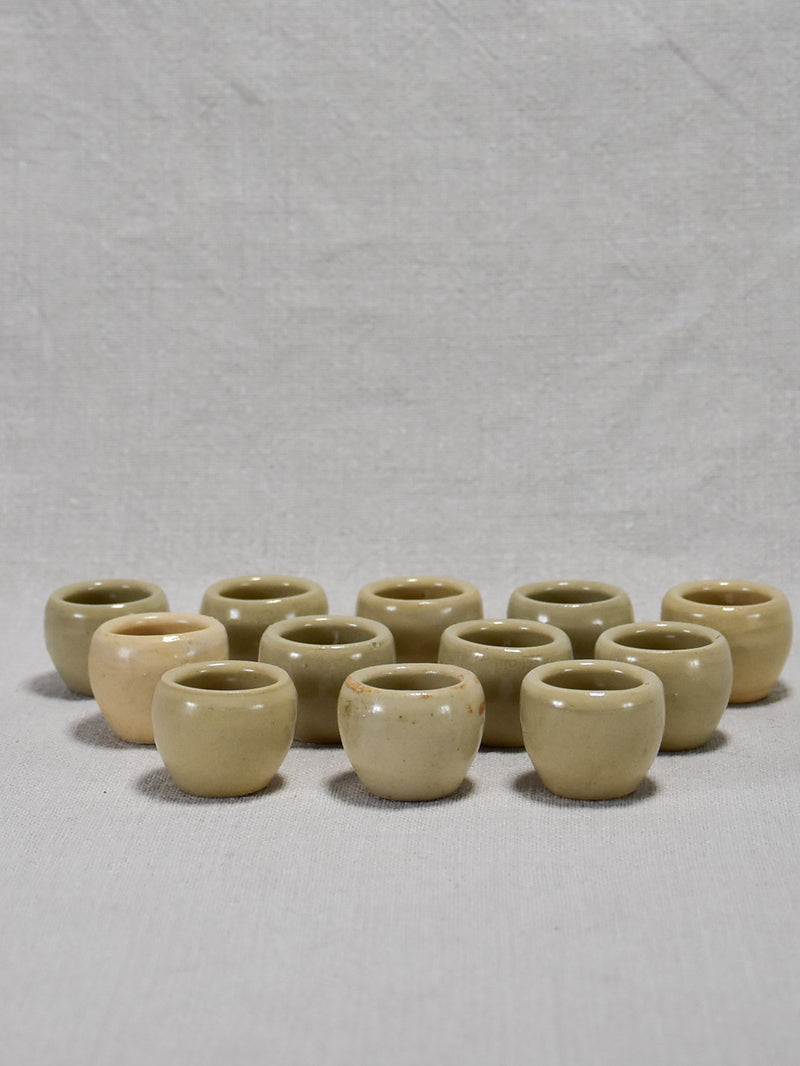 Collection of twelve vintage snail pots - gray glaze 1¼"