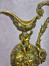 Bronze Napoleon III pitcher adorned with foliage, fruit and a cherub 17¾"