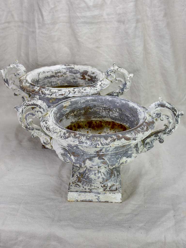 Pair of antique French Medici urns with large handles and white patina