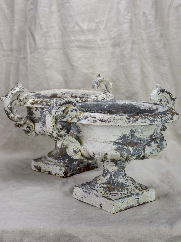 Pair of antique French Medici urns with large handles and white patina