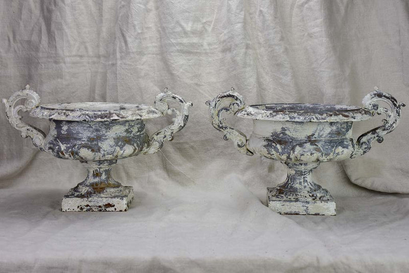 Pair of antique French Medici urns with large handles and white patina