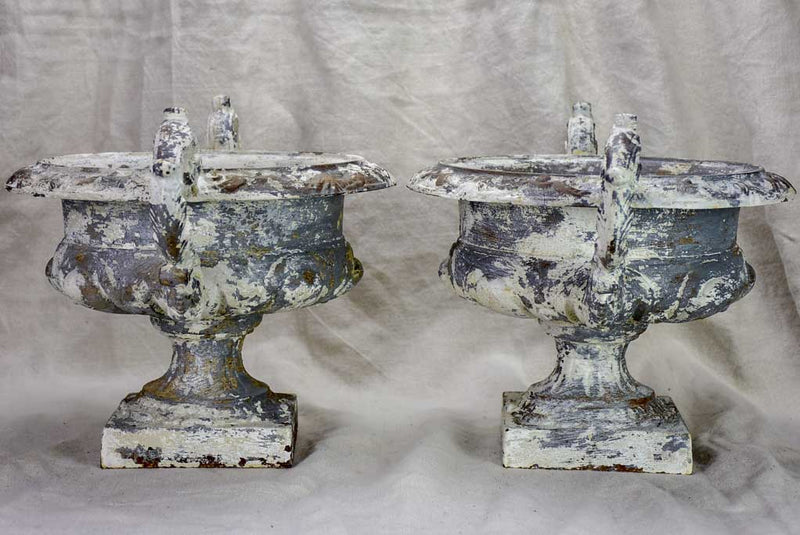 Pair of antique French Medici urns with large handles and white patina