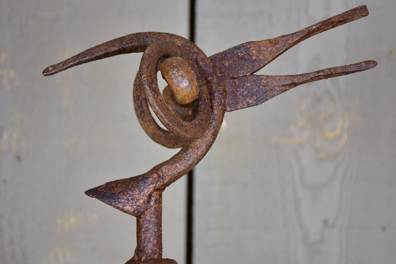 Bird sculpture made from salvaged driftwood and wrought iron