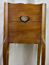 Antique French nightstand with ribbed doors and heart shaped cut out