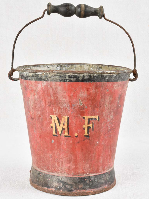 Antique red metal bucket with MF monogram 9"