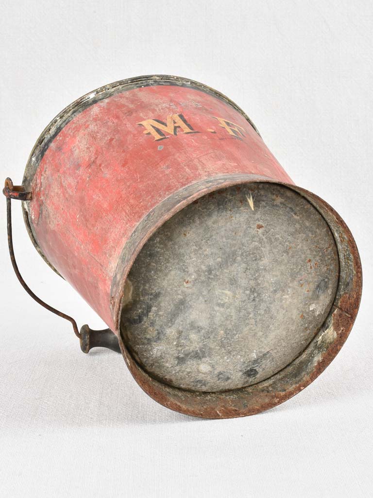 Antique red metal bucket with MF monogram 9"
