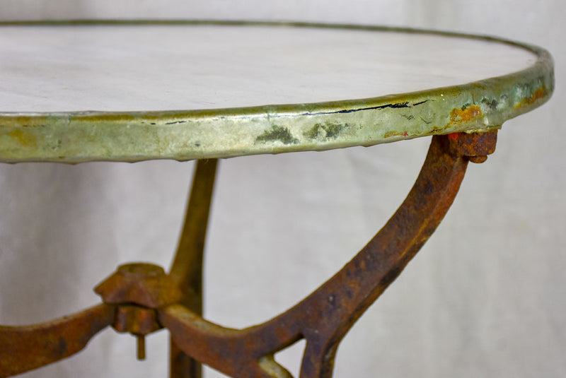 Antique French bistro table with marble top and cast iron base