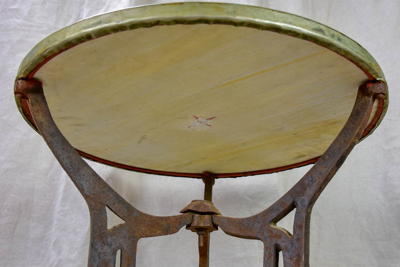 Antique French bistro table with marble top and cast iron base