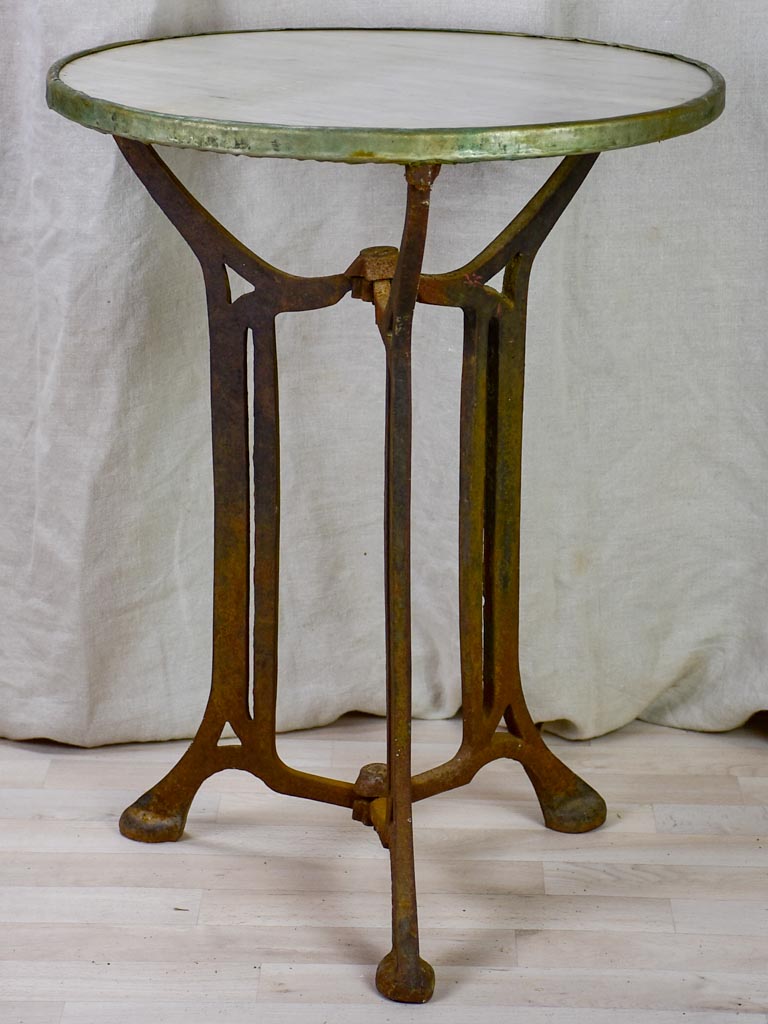 Antique French bistro table with marble top and cast iron base