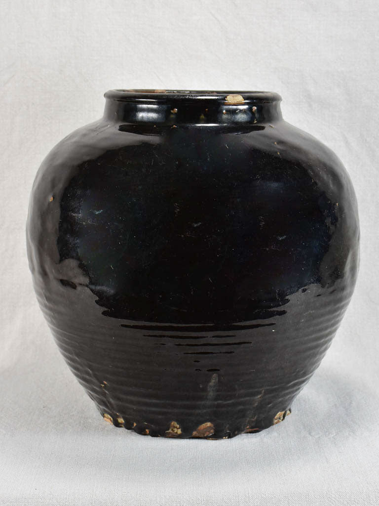 Large decorative antique pot with black glaze and ribbed base 14½"