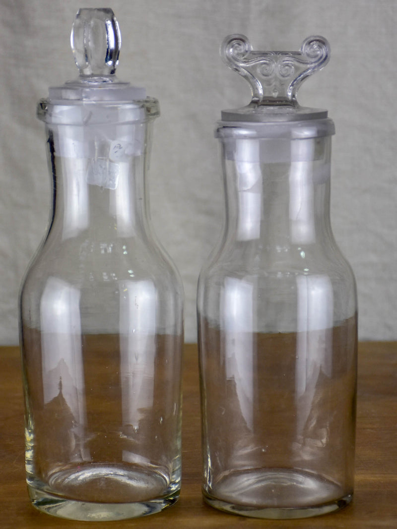 Two antique French glass apothecary bottles