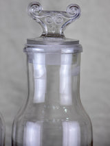 Two antique French glass apothecary bottles