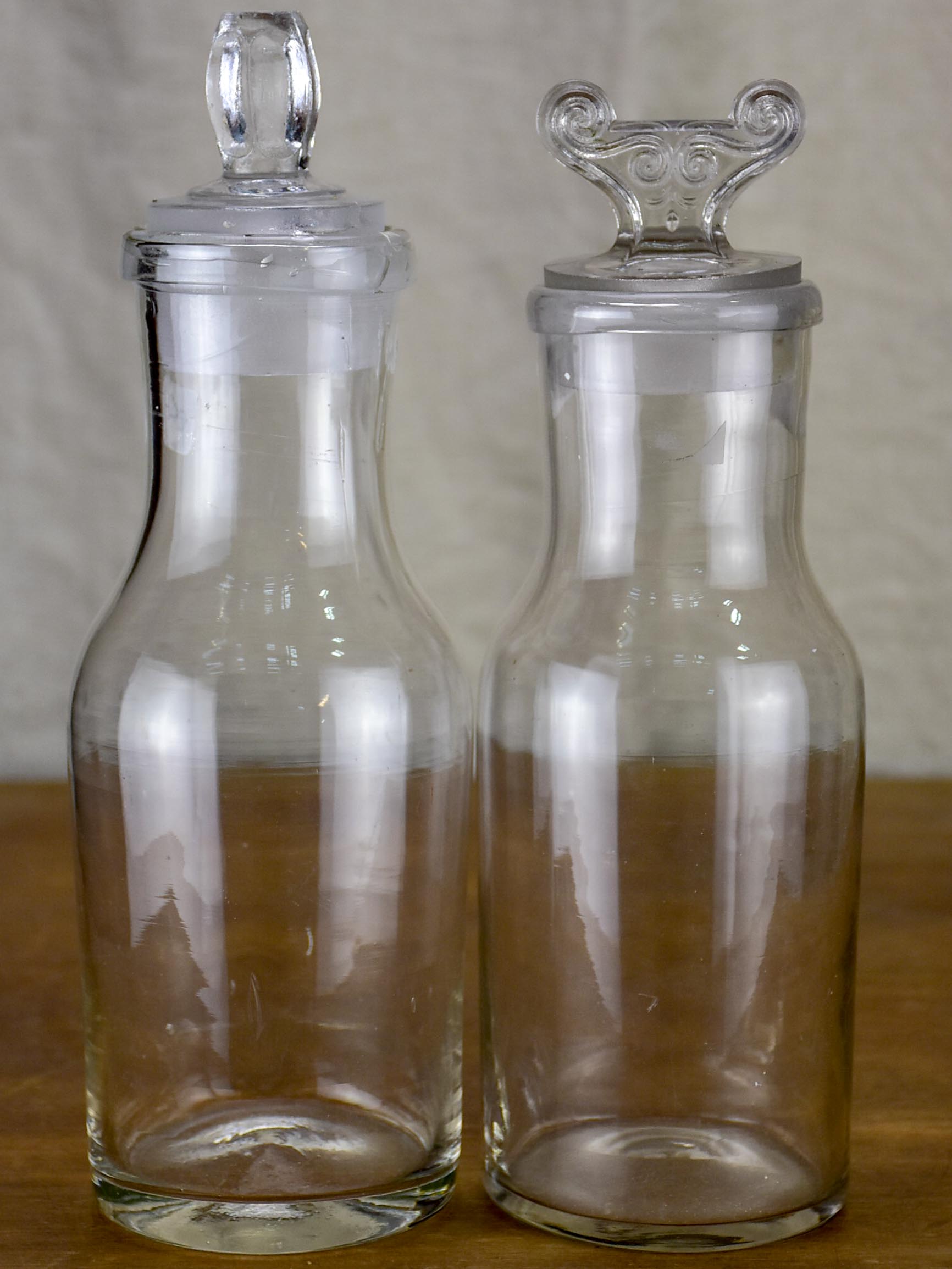 Two antique French glass apothecary bottles