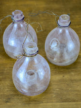 Three antique French fly-trap bottles - purple tinge