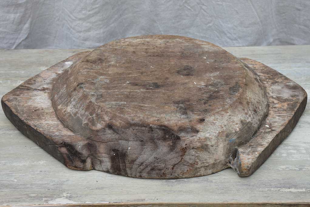 Primitive wooden dish with pointed handles