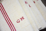 Four French tea towels with GH monogram