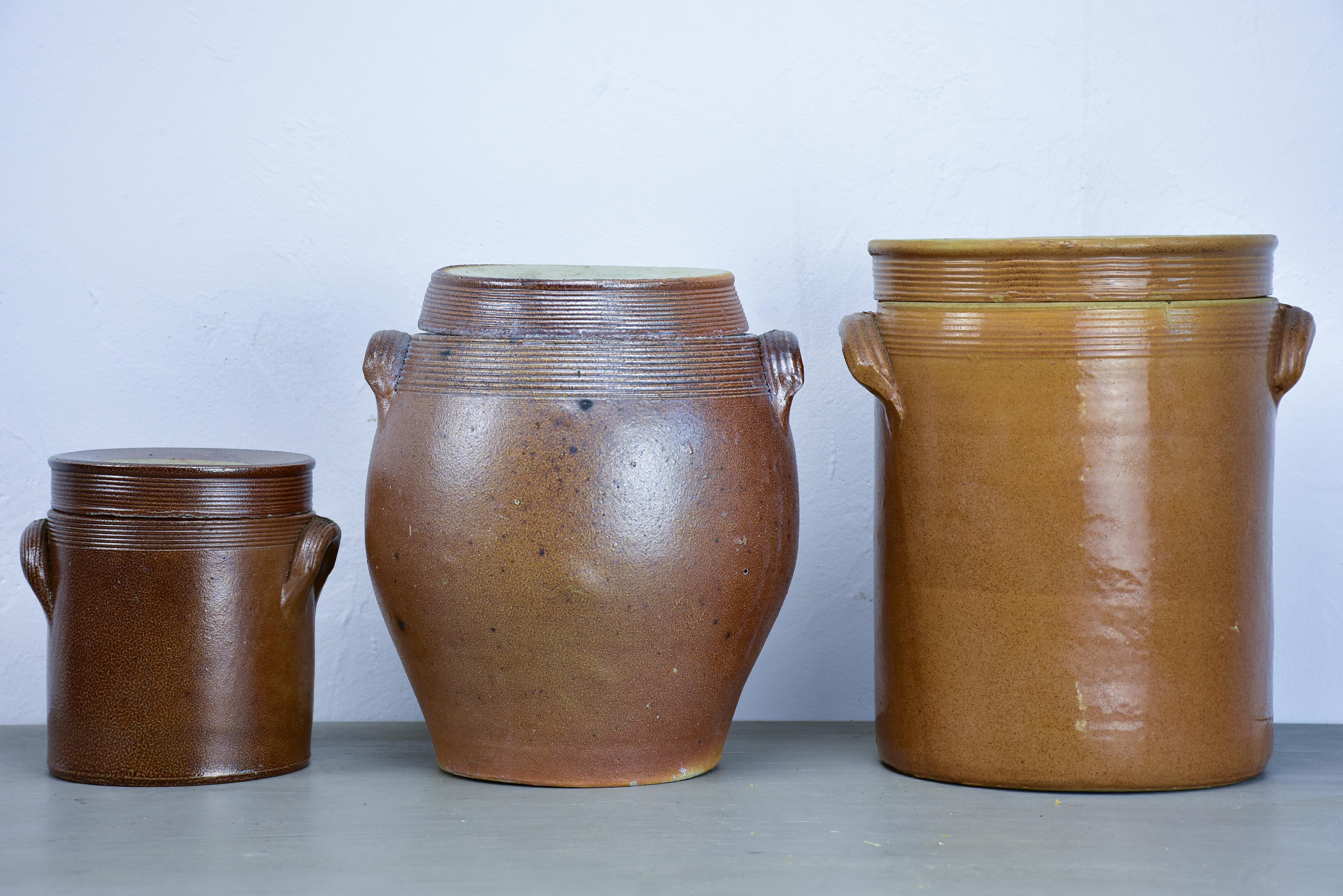 Three antique French earthenware preserving pots