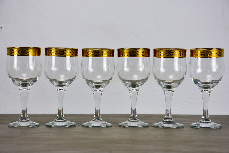 Six antique French wine glasses with gold rim