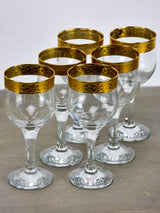 Six antique French wine glasses with gold rim