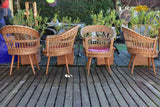 Four vintage French rattan armchairs