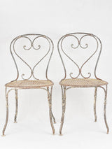 Pair of antique heart back garden chairs