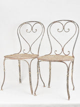 Pair of antique heart back garden chairs